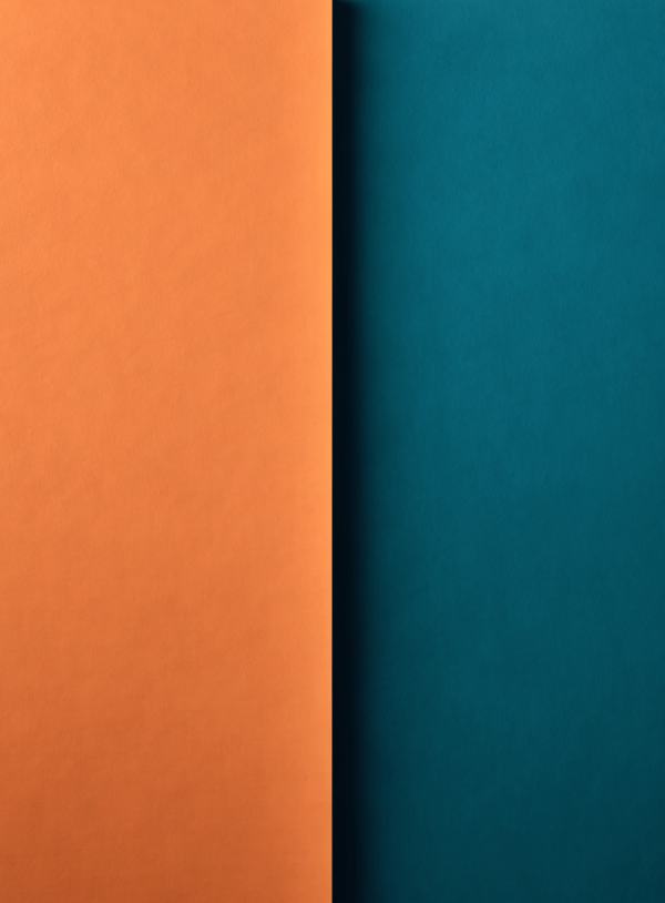 9gq1RifdmPtb5n_XpW2YF_W0u0CyJd.webp A tall composition split down the middle by a single vertical edge, warm terracotta on one side and cool teal on the other.