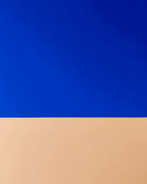 Two flat colour fields in a vertical format meeting on a single hard horizontal edge, with the darker, heavier field above the lighter field below.