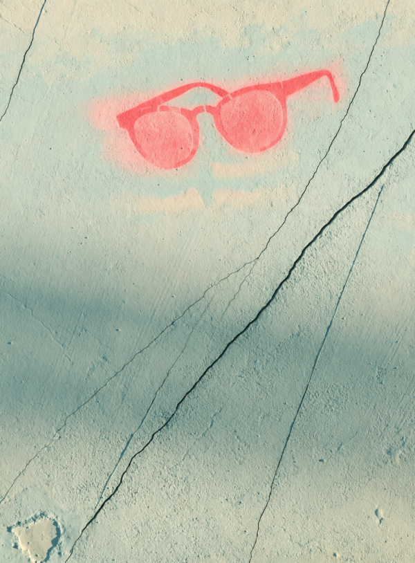 Flat cracked mint and cream plaster wall with a painted-over patch and a small coral pink stencilled sunglasses shape near one edge.